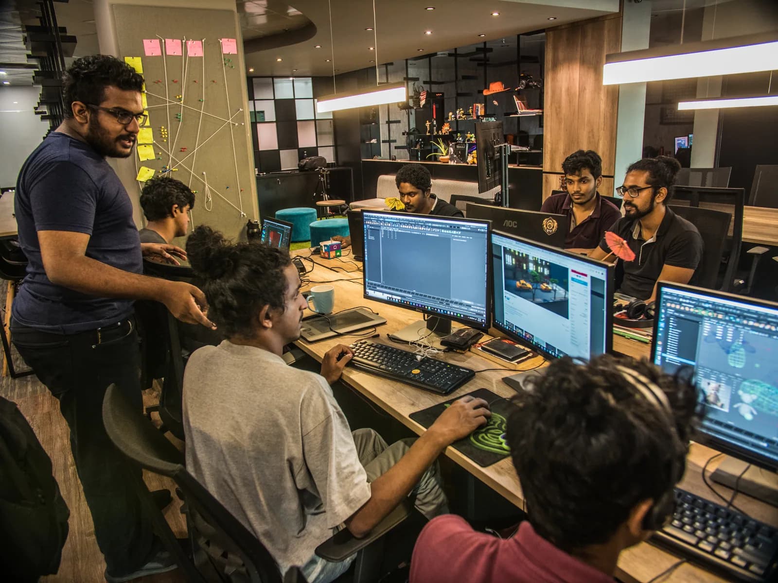 Colleagues developing projects together at their computers