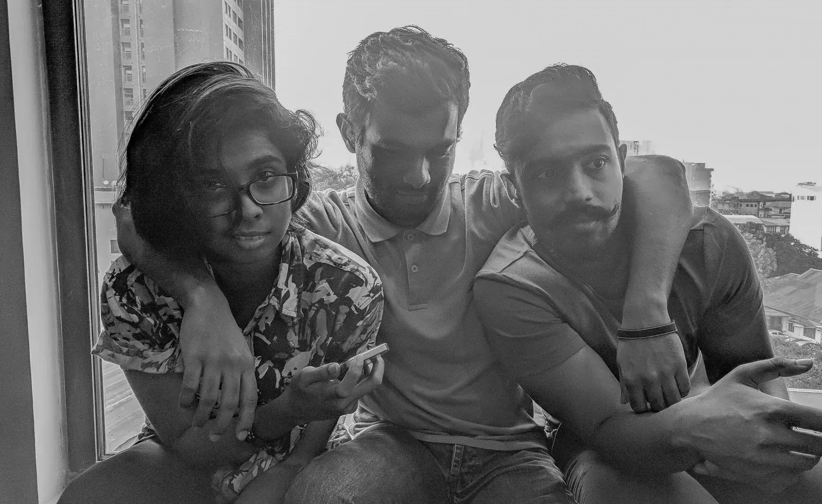 Three colleagues reviewing work together